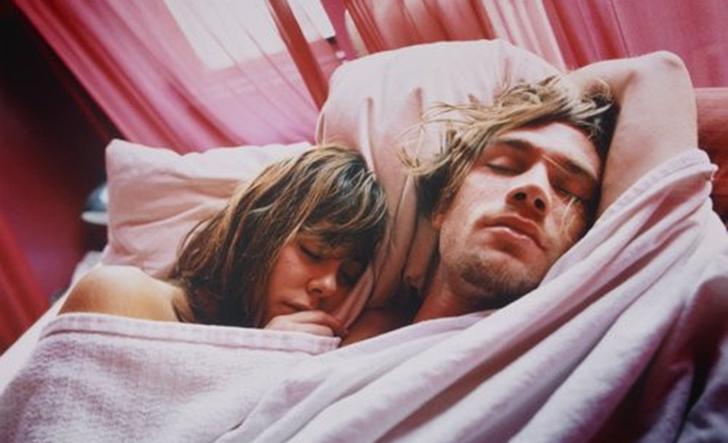 Young Couple Sleeping in Bed --- Image by © Glenn Glasser/Corbis